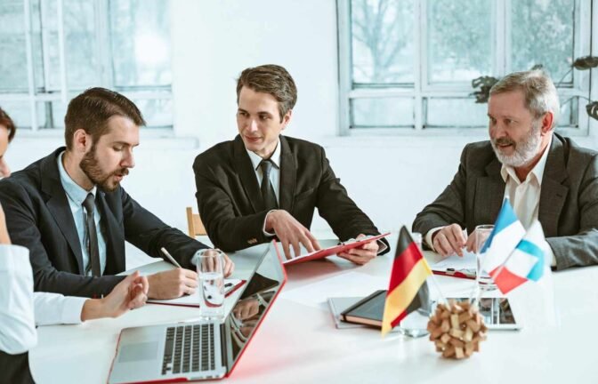 Legal professionals discussing case management strategies using the Best CRM for Law Firms 2025 to improve efficiency and client communication.