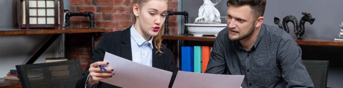 Law firm professionals reviewing documents — how Virtual Legal Assistants help cut costs and improve efficiency.