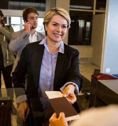 Immigration lawyer assisting clients efficiently at a reception desk.