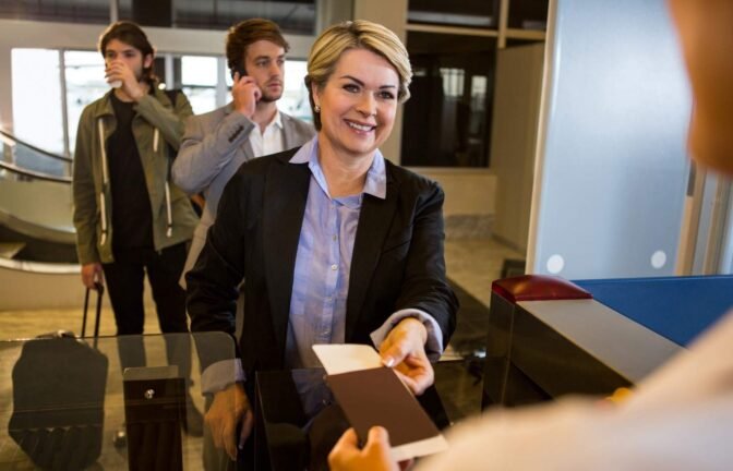 Immigration lawyer assisting clients efficiently at a reception desk.
