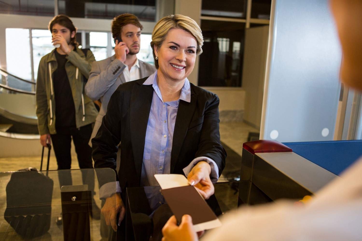 Immigration lawyer assisting clients efficiently at a reception desk.