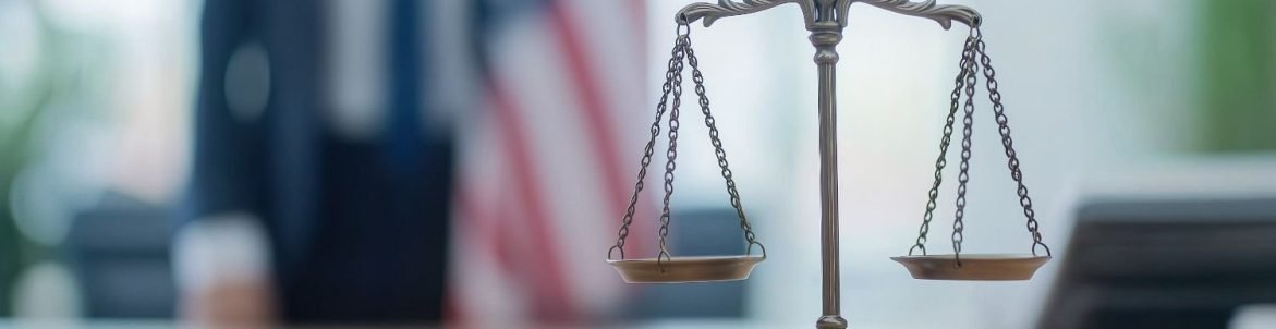 Immigration Litigation Support Services - Legal Balance Scale in Law Firm with American Flag in Background.