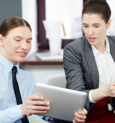 Virtual paralegals discussing immigration case management software on a tablet.