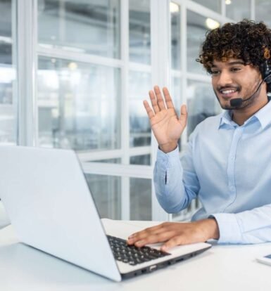 Virtual paralegal assisting with immigration filings, using a laptop and headset to manage proof of business documents.