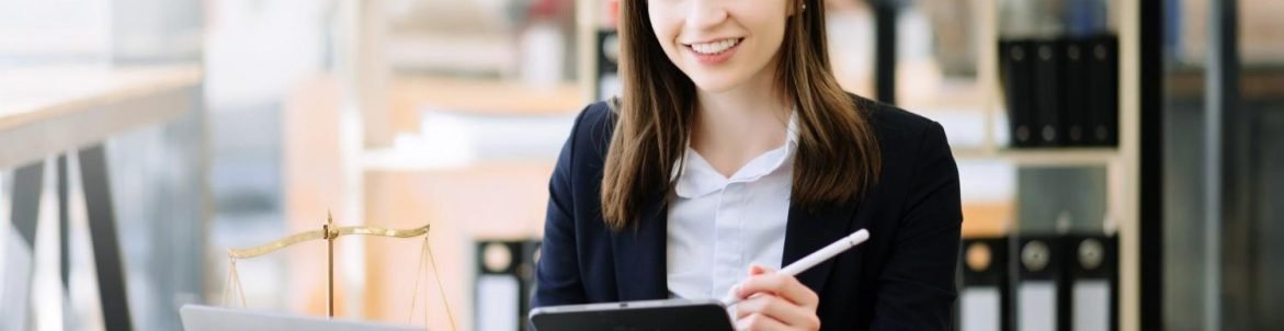 Smiling legal professional using a tablet and AI-powered tools to streamline law firm workflows in a modern office setting.