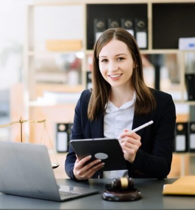 Smiling legal professional using a tablet and AI-powered tools to streamline law firm workflows in a modern office setting.