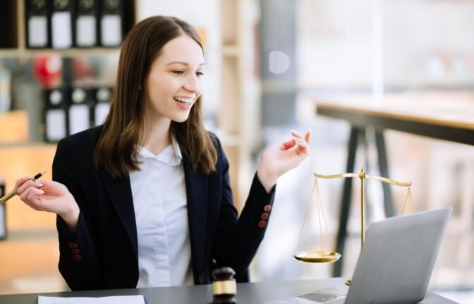 Smiling female attorney using a Virtual Legal Assistant for H-1B and DV Lottery applications, improving efficiency and workflow.