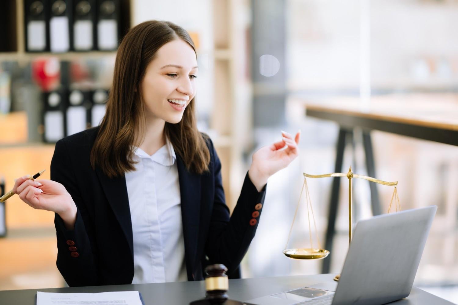 Smiling female attorney using a Virtual Legal Assistant for H-1B and DV Lottery applications, improving efficiency and workflow.