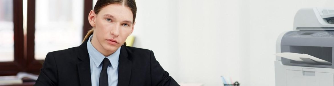 Legal professional working at a desk, organizing case files and documents to improve law firm efficiency.